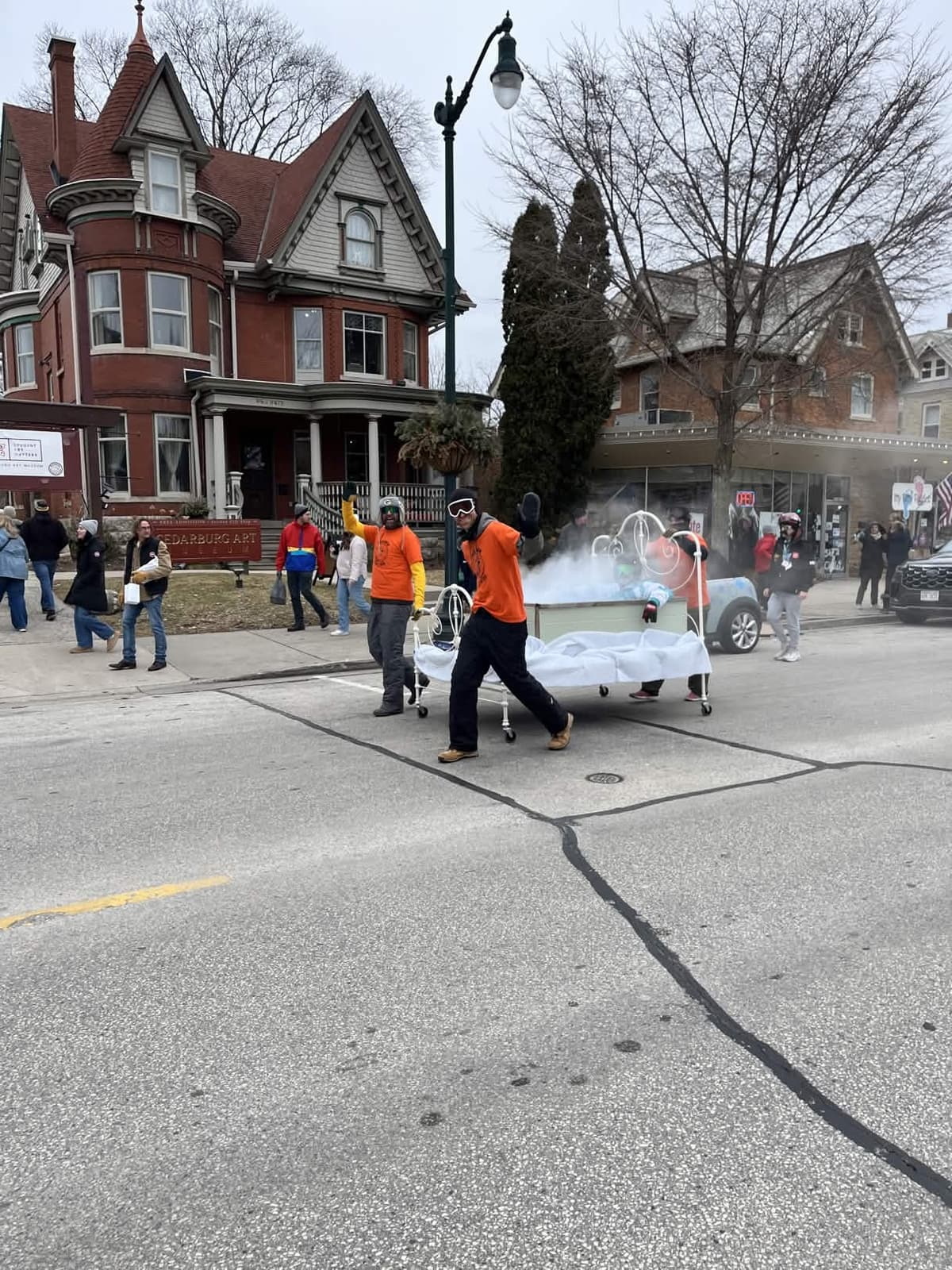 2026 Bed Races action shot — the hot tub time machine bed racing with steam